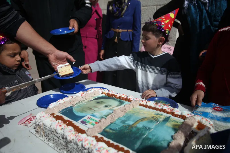 Palestinian members of Al Sawahra family celebrate Daoud Al Sawahra, 5, birthday at the yard of Jerusalem Municipality in a protest against demolishing their house by Israeli authority in Jerusalem, on Feb. 23, 2014. Isr...