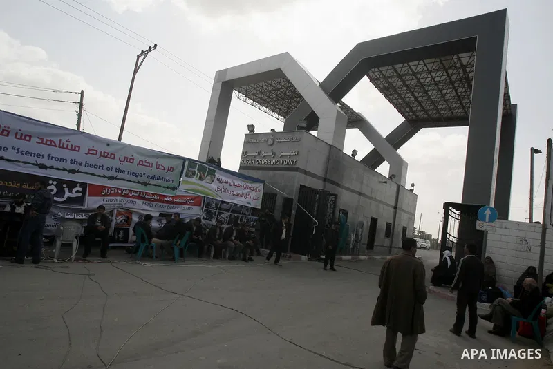 Palestinians take part during a protest tent in front of the Rafah border crossing between Egypt and the southern Gaza Strip, on Feb. 23, 2014. The crossing, which is the sole connection between the Gaza Strip's 1.5 mill...