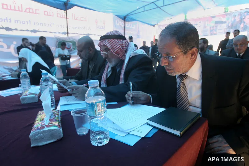 Members of the Palestinian Legislative Council in Gaza Strip attend a press conference to demand the opening of the Rafah crossing during a participate in a protest tent in front of the Rafah border crossing between Egyp...