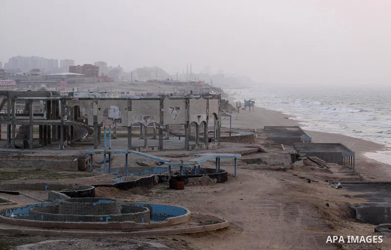 A picture shows destroyed buildings at al-Waha area near the Mediterranean Sea beach front, in the northern Gaza Strip, February 23, 2014. The Israeli aircraft and gunboats targeted most of buildings in the area since th...