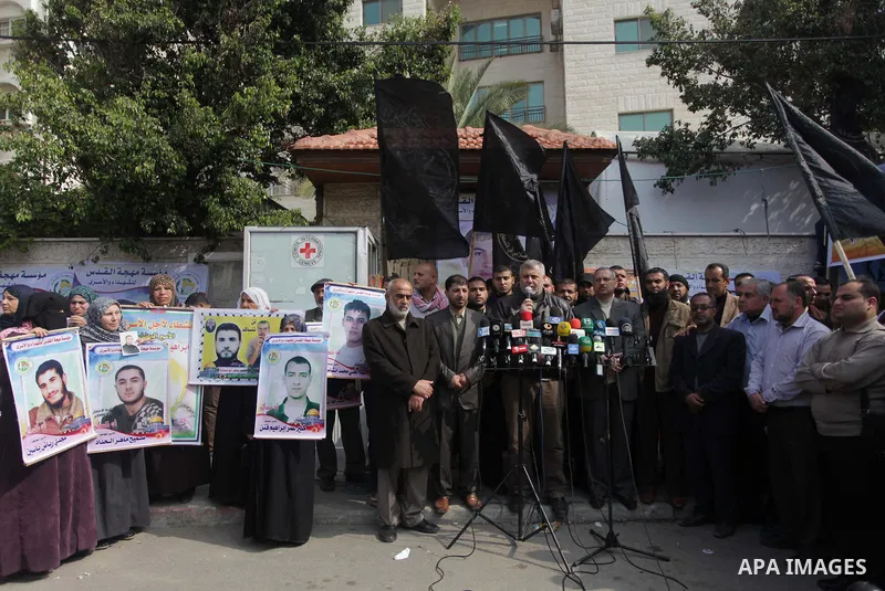 Palestinians take part in a protest demanding the release of their relatives prisoners held in Israeli jails, in front of the Red Cross office in Gaza City, on Feb. 24, 2014. Photo by Ashraf Amra