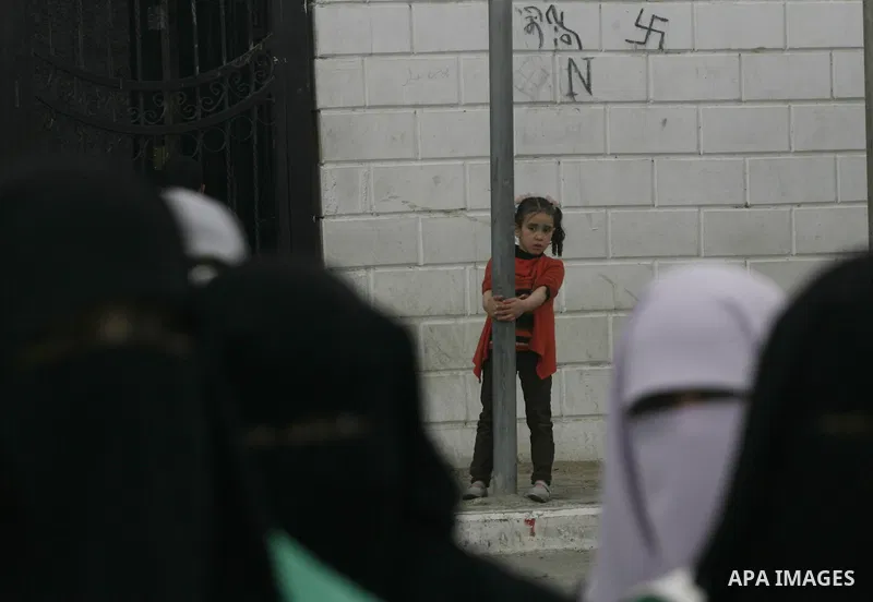 Palestinians gather during a protest in front of the Rafah border crossing with Egypt in the southern Gaza Strip on February 24, 2014, to demand that Egypt lift border crossing restrictions. Egypt imposed the restriction...