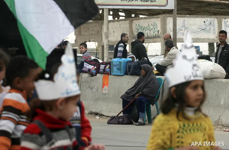 Palestinians gather during a protest in front of the Rafah border crossing with Egypt in the southern Gaza Strip on February 24, 2014, to demand that Egypt lift border crossing restrictions. Egypt imposed the restriction...