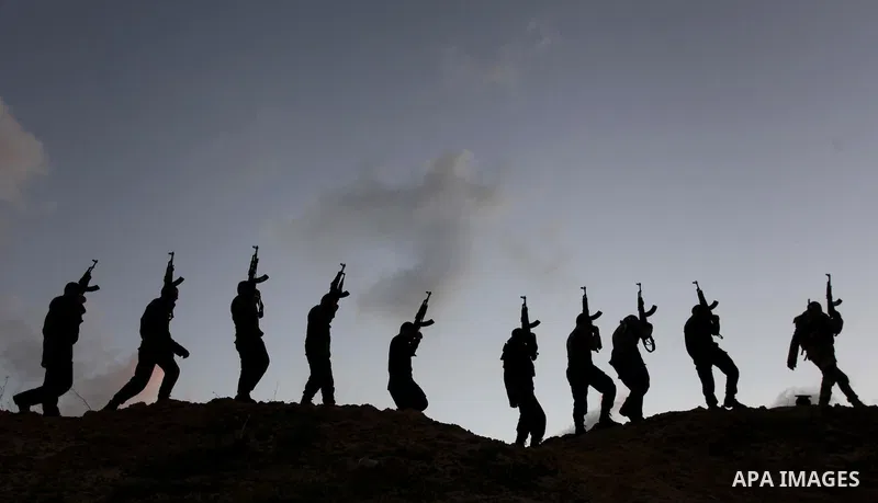 A picture taken on February 17, 2014, shows Palestinian Hamas militants march during a training exercise in Gaza . Photo by Ashraf Amra