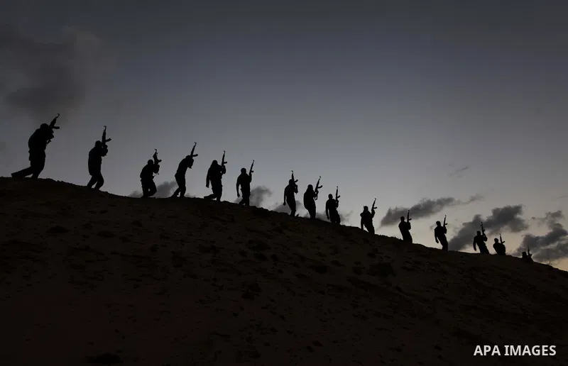 A picture taken on February 17, 2014, shows Palestinian Hamas militants march during a training exercise in Gaza . Photo by Ashraf Amra