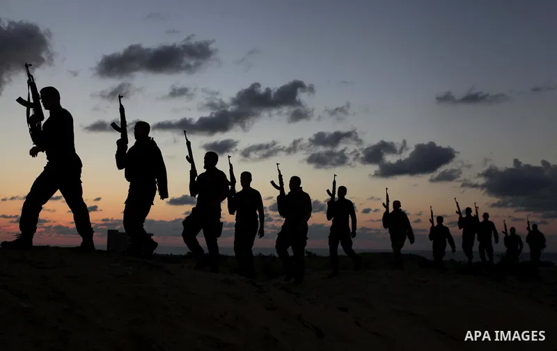 A picture taken on February 17, 2014, shows Palestinian Hamas militants march during a training exercise in Gaza . Photo by Ashraf Amra