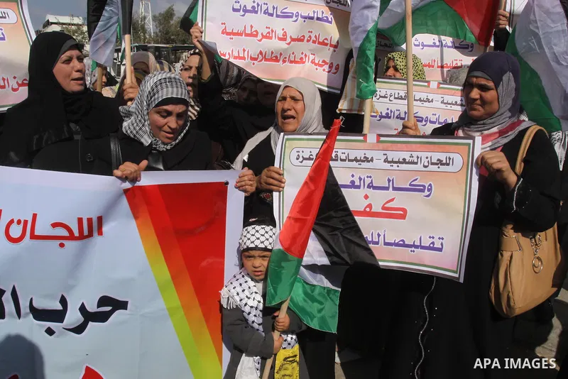 Palestinians take part a protest against the UNRWA decision to reduce of the food aid in front of the headquarters United Nations Relief and Works Agency (UNRWA) in Gaza city, on Feb. 25, 2014. Photo by Mohammed Asad