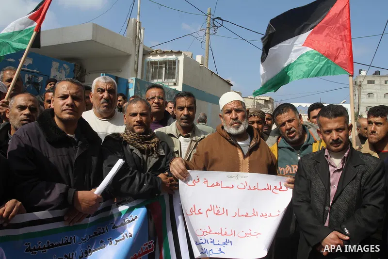 Palestinians take part a protest against the UNRWA decision to reduce of the food aid in front of the headquarters United Nations Relief and Works Agency (UNRWA) in Gaza city, on Feb. 25, 2014. Photo by Mohammed Asad