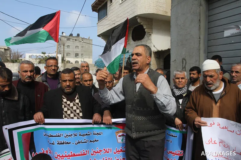 Palestinians take part a protest against the UNRWA decision to reduce of the food aid in front of the headquarters United Nations Relief and Works Agency (UNRWA) in Gaza city, on Feb. 25, 2014. Photo by Mohammed Asad