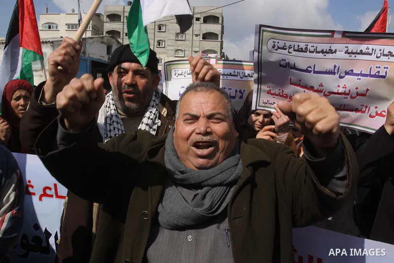Palestinians take part a protest against the UNRWA decision to reduce of the food aid in front of the headquarters United Nations Relief and Works Agency (UNRWA) in Gaza city, on Feb. 25, 2014. Photo by Mohammed Asad