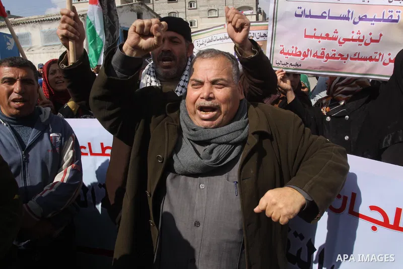 Palestinians take part a protest against the UNRWA decision to reduce of the food aid in front of the headquarters United Nations Relief and Works Agency (UNRWA) in Gaza city, on Feb. 25, 2014. Photo by Mohammed Asad