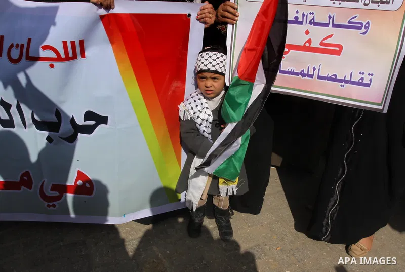 Palestinians take part a protest against the UNRWA decision to reduce of the food aid in front of the headquarters United Nations Relief and Works Agency (UNRWA) in Gaza city, on Feb. 25, 2014. Photo by Mohammed Asad
