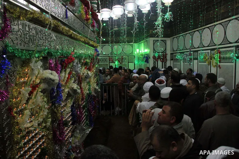 Worshippers attend the El Ishaa prayers at the Al-Hussein mosque, during celebration day of "Moulid Al-Hussein" the birthday of Prophet Mohammad's grandson Hussein in Cairo, February 25, 2014. Photo by Mohammed Bendari