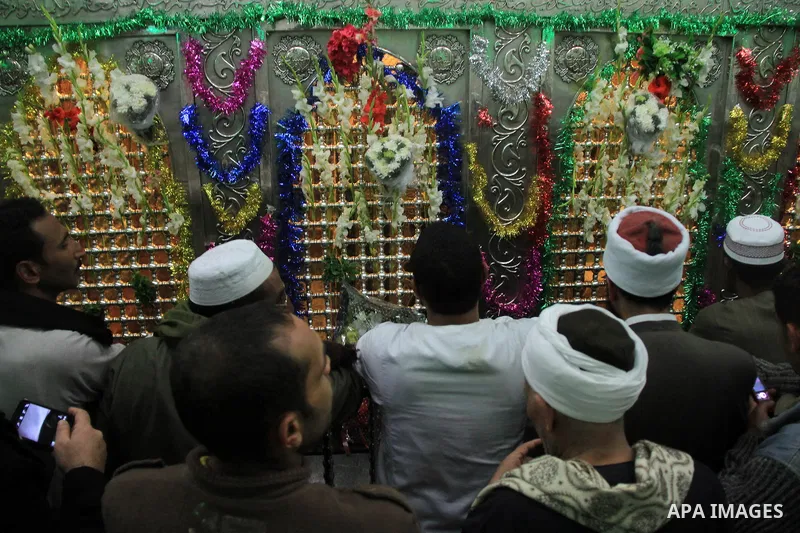 Worshippers attend the El Ishaa prayers at the Al-Hussein mosque, during celebration day of "Moulid Al-Hussein" the birthday of Prophet Mohammad's grandson Hussein in Cairo, February 25, 2014. Photo by Mohammed Bendari