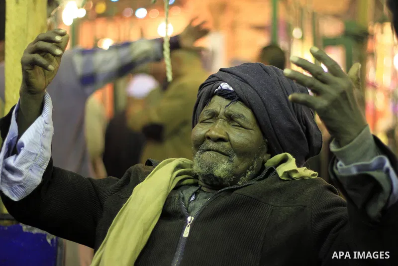 Worshippers attend the El Ishaa prayers at the Al-Hussein mosque, during celebration day of "Moulid Al-Hussein" the birthday of Prophet Mohammad's grandson Hussein in Cairo, February 25, 2014. Photo by Mohammed Bendari