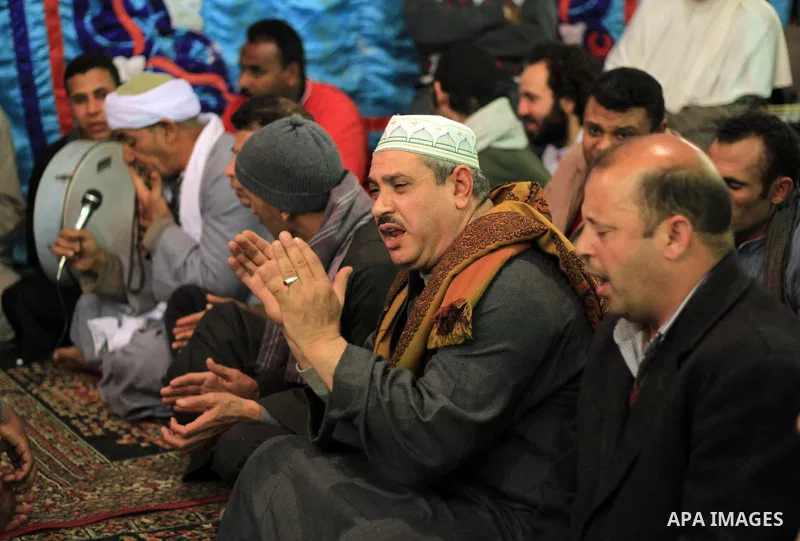 Worshippers attend the El Ishaa prayers at the Al-Hussein mosque, during celebration day of "Moulid Al-Hussein" the birthday of Prophet Mohammad's grandson Hussein in Cairo, February 25, 2014. Photo by Mohammed Bendari