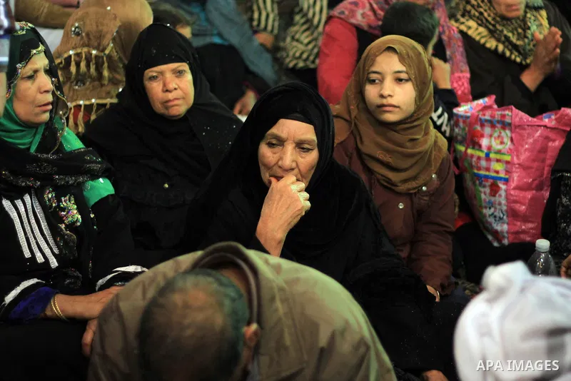 Worshippers attend the El Ishaa prayers at the Al-Hussein mosque, during celebration day of "Moulid Al-Hussein" the birthday of Prophet Mohammad's grandson Hussein in Cairo, February 25, 2014. Photo by Mohammed Bendari