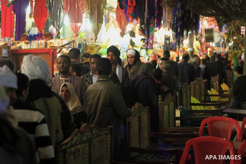 Worshippers attend the El Ishaa prayers at the Al-Hussein mosque, during celebration day of "Moulid Al-Hussein" the birthday of Prophet Mohammad's grandson Hussein in Cairo, February 25, 2014. Photo by Mohammed Bendari
