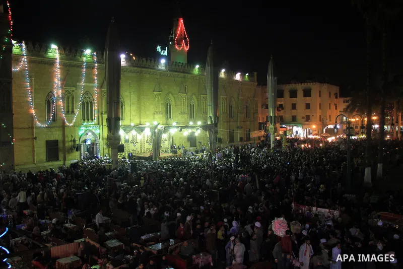 Worshippers attend the El Ishaa prayers at the Al-Hussein mosque, during celebration day of "Moulid Al-Hussein" the birthday of Prophet Mohammad's grandson Hussein in Cairo, February 25, 2014. Photo by Mohammed Bendari
