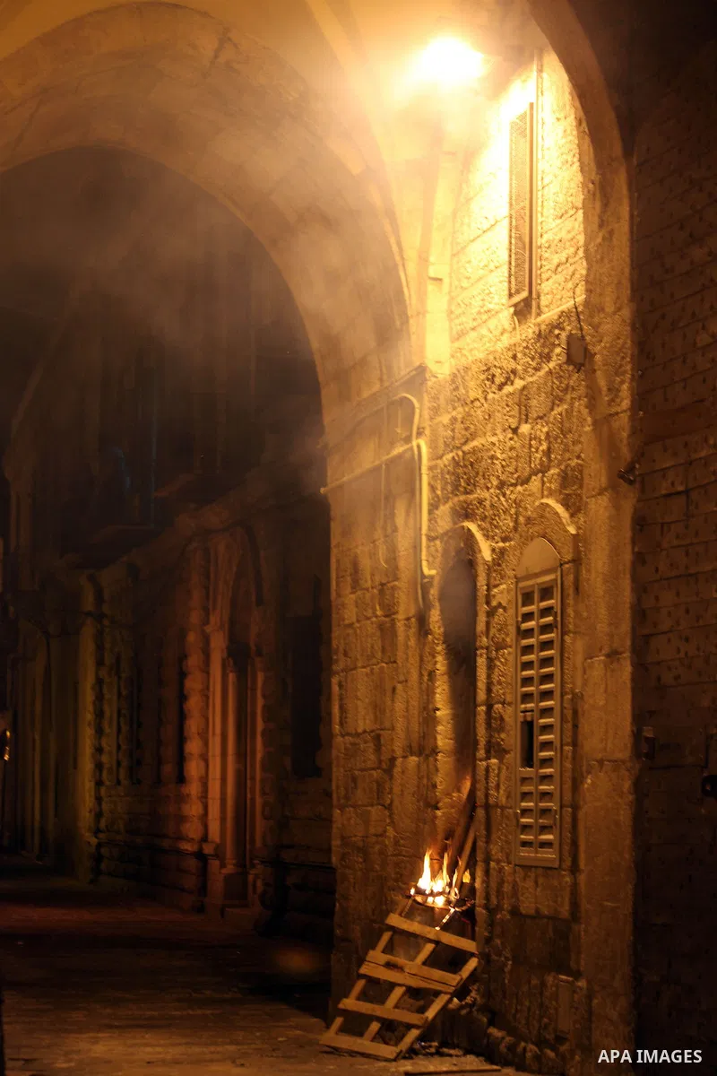 A fire burns at the police station of Asbat Gate" in Jerusalem during a demonstration following the funeral Prisoner Jihad al-Tawil in Jerusalem on February 26, 2014. Prisoner Jihad al-Tawil, from Jerusalem died Tuesday...