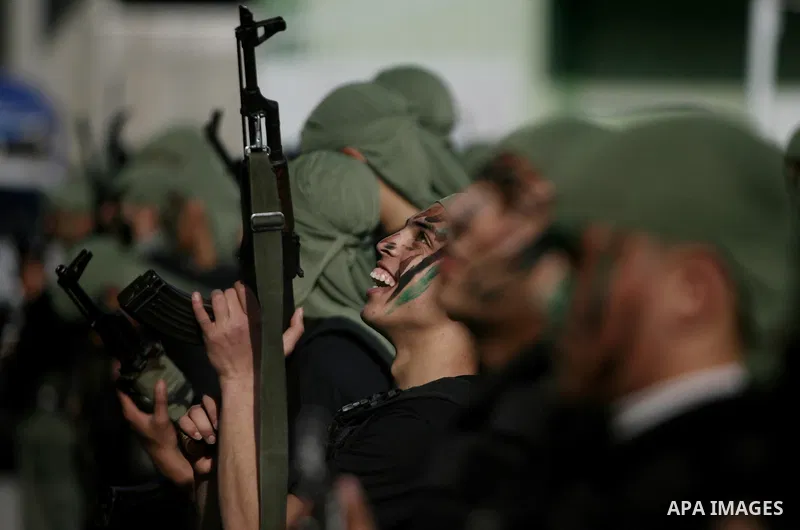 Palestinian students take part in a military march organised by Hamas national security in a street in Rafah town, in the southern Gaza Strip, on February 27, 2014. Thousands of youngsters between the age of six and 16,...