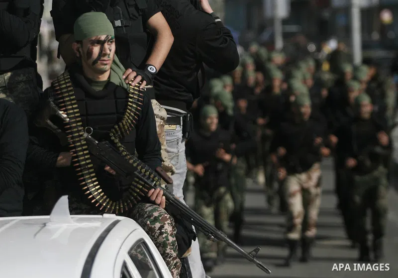 Palestinian students take part in a military march organised by Hamas national security in a street in Rafah town, in the southern Gaza Strip, on February 27, 2014. Thousands of youngsters between the age of six and 16,...