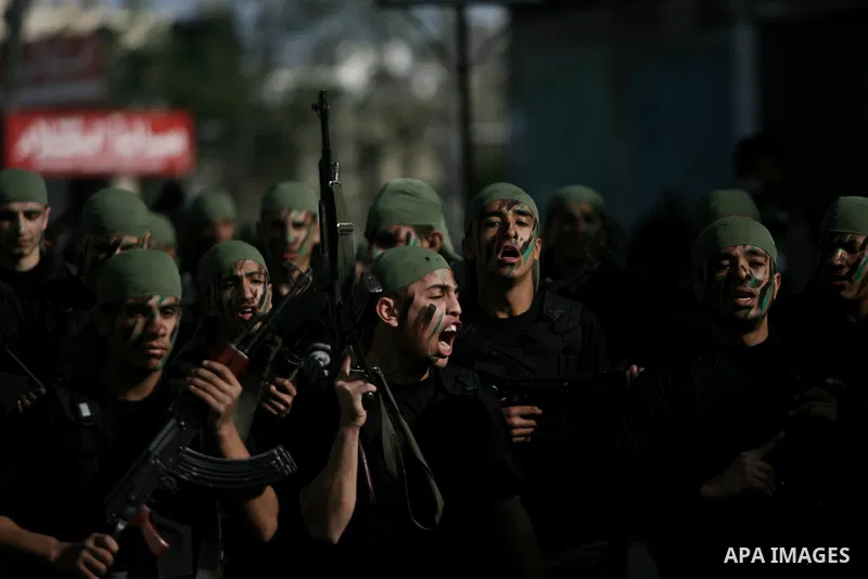Palestinian students take part in a military march organised by Hamas national security in a street in Rafah town, in the southern Gaza Strip, on February 27, 2014. Thousands of youngsters between the age of six and 16,...