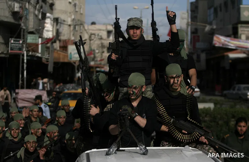 Palestinian students take part in a military march organised by Hamas national security in a street in Rafah town, in the southern Gaza Strip, on February 27, 2014. Thousands of youngsters between the age of six and 16,...