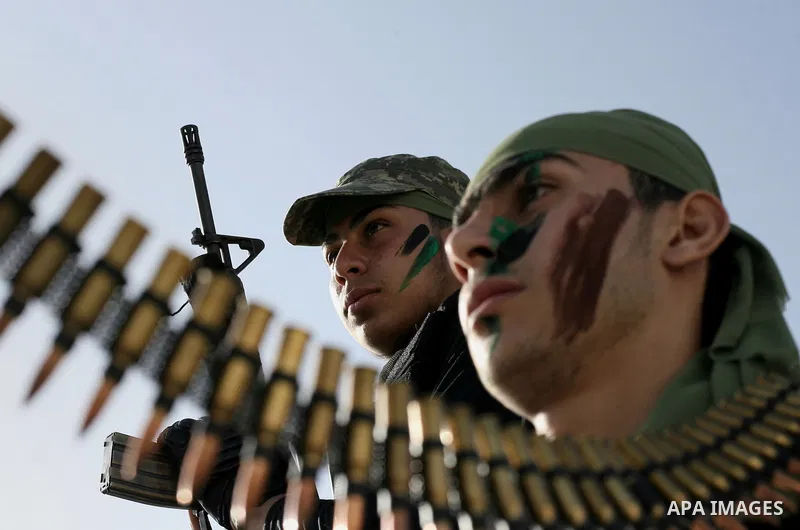 Palestinian students take part in a military march organised by Hamas national security in a street in Rafah town, in the southern Gaza Strip, on February 27, 2014. Thousands of youngsters between the age of six and 16,...