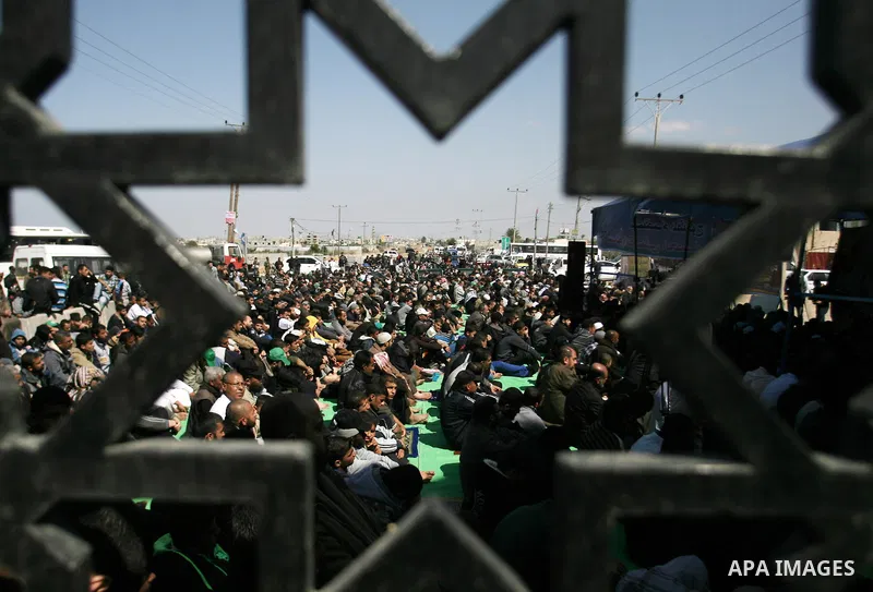 Palestinian Hamas movement supporters take part in Friday prayers outside the Rafah crossing between Gaza Strip and Egypt in protest against the closure of crossing by Egyptian authorities, southern Gaza Strip on Februar...