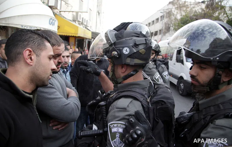 Israeli policemen arrest a Palestinian during clashes in East Jerusalem neighborhood Ras al-Amud, on March 01, 2014. Photo by Saeed Qaq