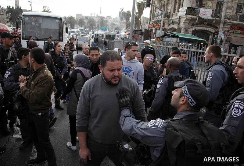 Israeli policemen arrest a Palestinian during clashes in East Jerusalem neighborhood Ras al-Amud, on March 01, 2014. Photo by Saeed Qaq