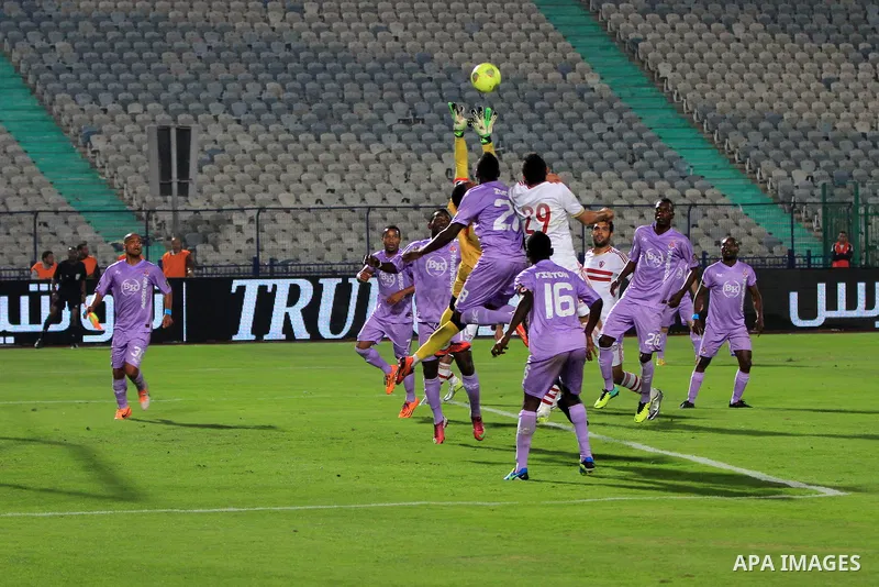 Egyptian players of al-zamalek club compete with kabuscorp sport club during their African Cup soccer match at the sports flowers club's headquarters in Cairo, capital of Egypt, on March 1, 2014. Photo by Mohammed Bendar...
