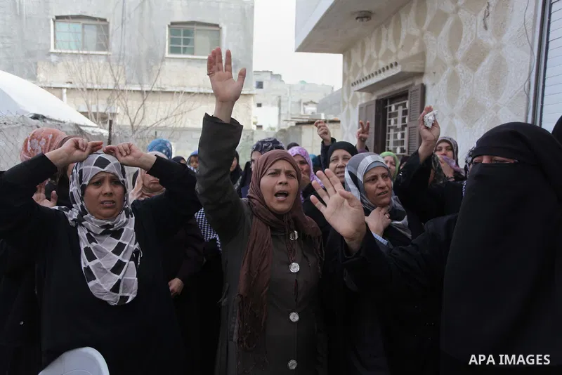Palestinian relatives of Sharif Nasser, 31, mourn during his funeral in Beit Hanoun in the northern Gaza Strip March 4, 2014. An Israeli air strike on Monday killed two Palestinians and wounded two others in the Gaza Str...