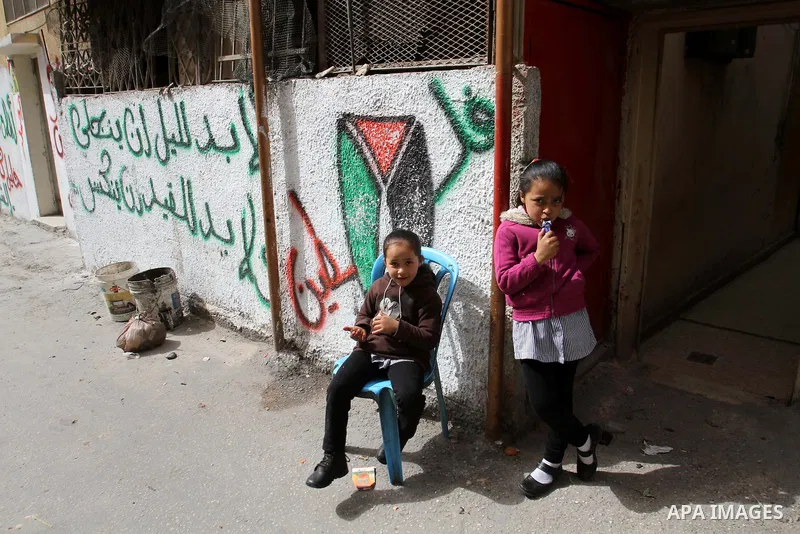 Palestinian girls play outside their family's house at Balata refugee camp, near the West Bank City of Nablus, March 04, 2014. Photo by Nedal Eshtayah