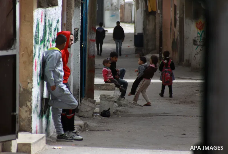 Palestinian children play outside their family's house at Balata refugee camp, near the West Bank City of Nablus, March 04, 2014. Photo by Nedal Eshtayah