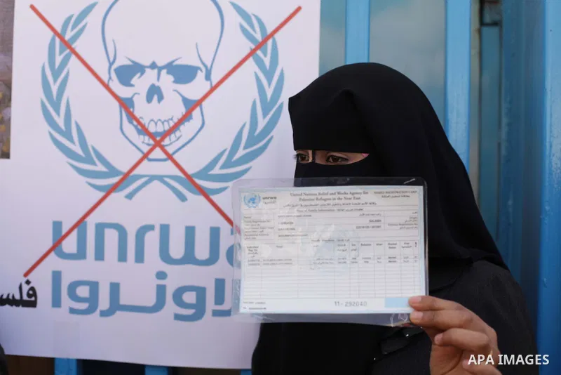Palestinian women take part in a protest against the decision made by the United Nations Relief and Works Agency (UNRWA) to reduce food aid delivered to the Gaza Strip in front of the UNRWA headquarters in Gaza City on M...