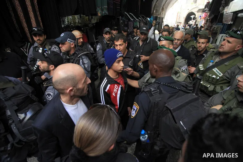 Israeli security forces detain a Palestinian youth following Friday prayers at the Al-Aqsa compound, Islam's third holiest site, in the old city of Jerusalem March 07, 2014. Photo by Saeed Qaq