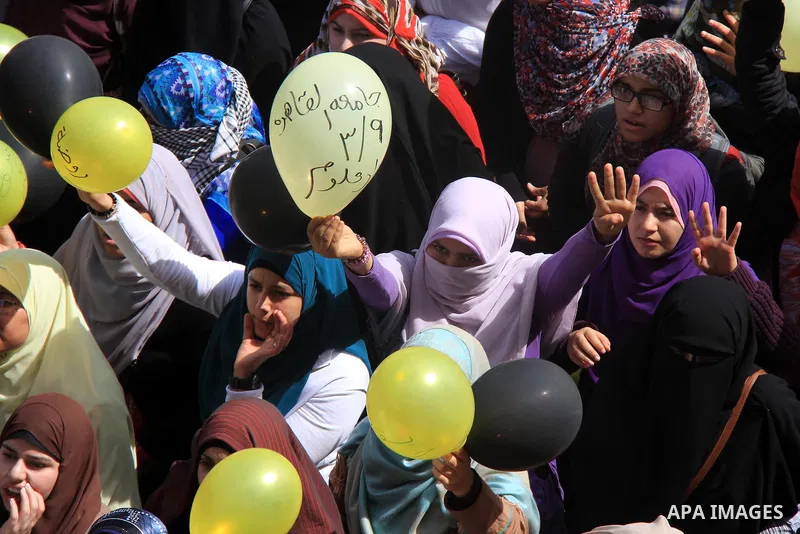 Egyptian students of Cairo University who support the Muslim Brotherhood and ousted Egyptian President Mohamed Mursi, take part in a demonstration against the military rule, in Cairo on March 09, 2014. Anti-coup students...