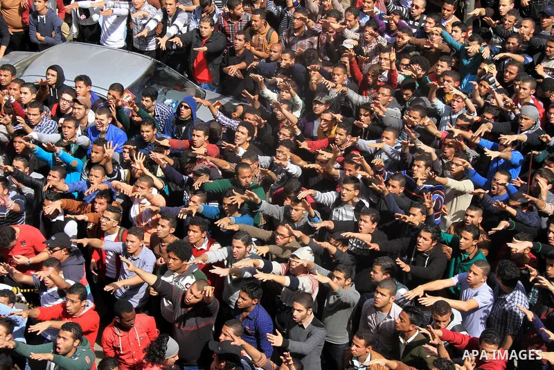 Egyptian students of Cairo University who support the Muslim Brotherhood and ousted Egyptian President Mohamed Mursi, take part in a demonstration against the military rule, in Cairo on March 09, 2014. Anti-coup students...