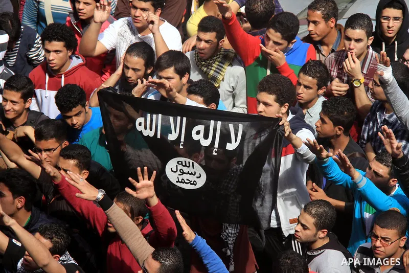 Egyptian students of Cairo University who support the Muslim Brotherhood and ousted Egyptian President Mohamed Mursi, take part in a demonstration against the military rule, in Cairo on March 09, 2014. Anti-coup students...