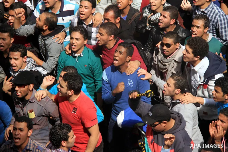 Egyptian students of Cairo University who support the Muslim Brotherhood and ousted Egyptian President Mohamed Mursi, take part in a demonstration against the military rule, in Cairo on March 09, 2014. Anti-coup students...