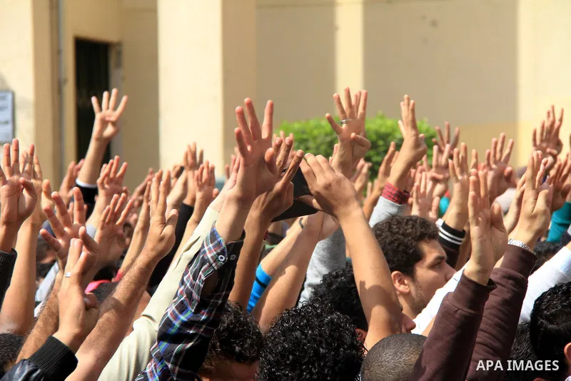 Egyptian students of Cairo University who support the Muslim Brotherhood and ousted Egyptian President Mohamed Mursi, take part in a demonstration against the military rule, in Cairo on March 09, 2014. Anti-coup students...