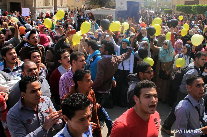 Egyptian students of Cairo University who support the Muslim Brotherhood and ousted Egyptian President Mohamed Mursi, take part in a demonstration against the military rule, in Cairo on March 09, 2014. Anti-coup students...