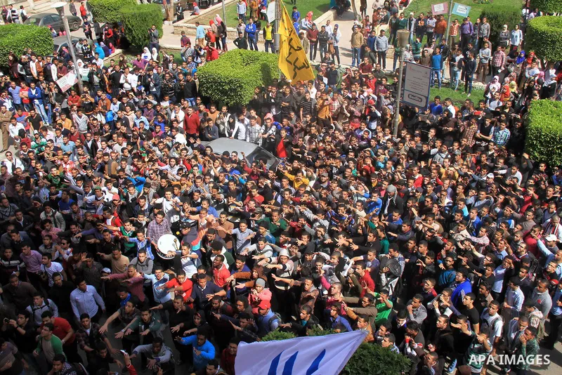 Egyptian students of Cairo University who support the Muslim Brotherhood and ousted Egyptian President Mohamed Mursi, take part in a demonstration against the military rule, in Cairo on March 09, 2014. Anti-coup students...