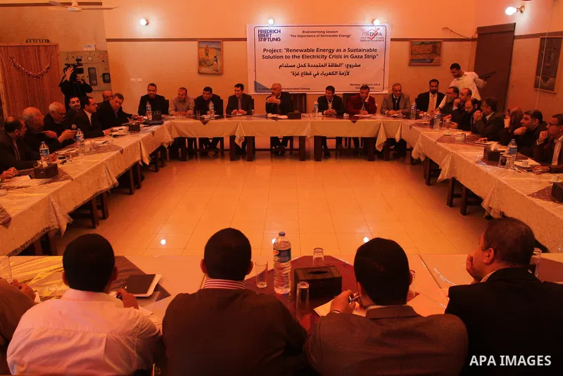 Palestinians take part in a workshop about the project of the renewable energy as a sustain able solution to the electricity crisis in Gaza strip in Gaza city on March 10, 2014. Photo by Mohammed Asad