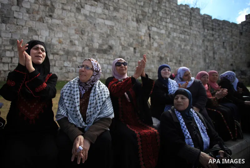 Palestinians participate in a simulated wedding marking the International Women's Day, in Jerusalem's Old City March 10, 2014. Photo by Saeed Qaq