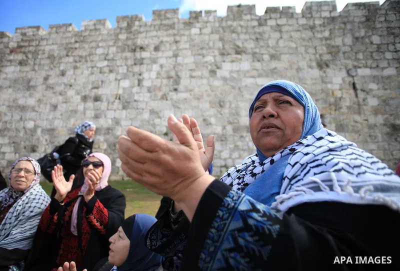 Palestinians participate in a simulated wedding marking the International Women's Day, in Jerusalem's Old City March 10, 2014. Photo by Saeed Qaq
