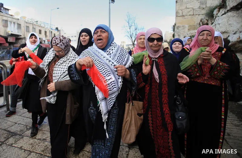 Palestinians participate in a simulated wedding marking the International Women's Day, in Jerusalem's Old City March 10, 2014. Photo by Saeed Qaq