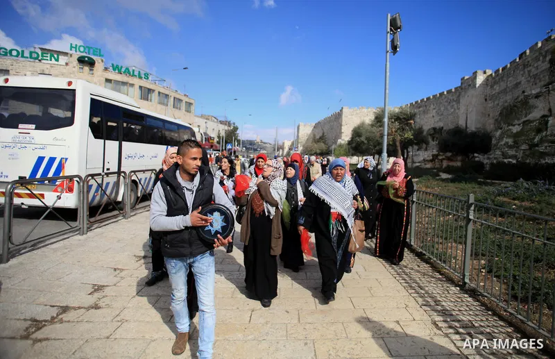 Palestinians participate in a simulated wedding marking the International Women's Day, in Jerusalem's Old City March 10, 2014. Photo by Saeed Qaq